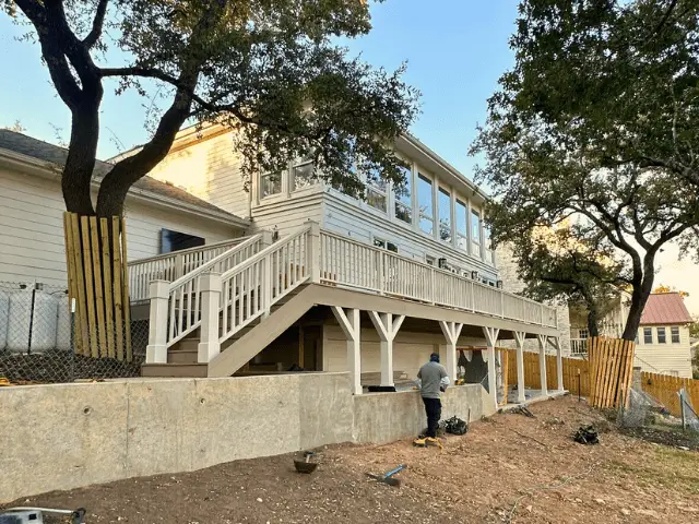 Residential wood deck with white painted railings